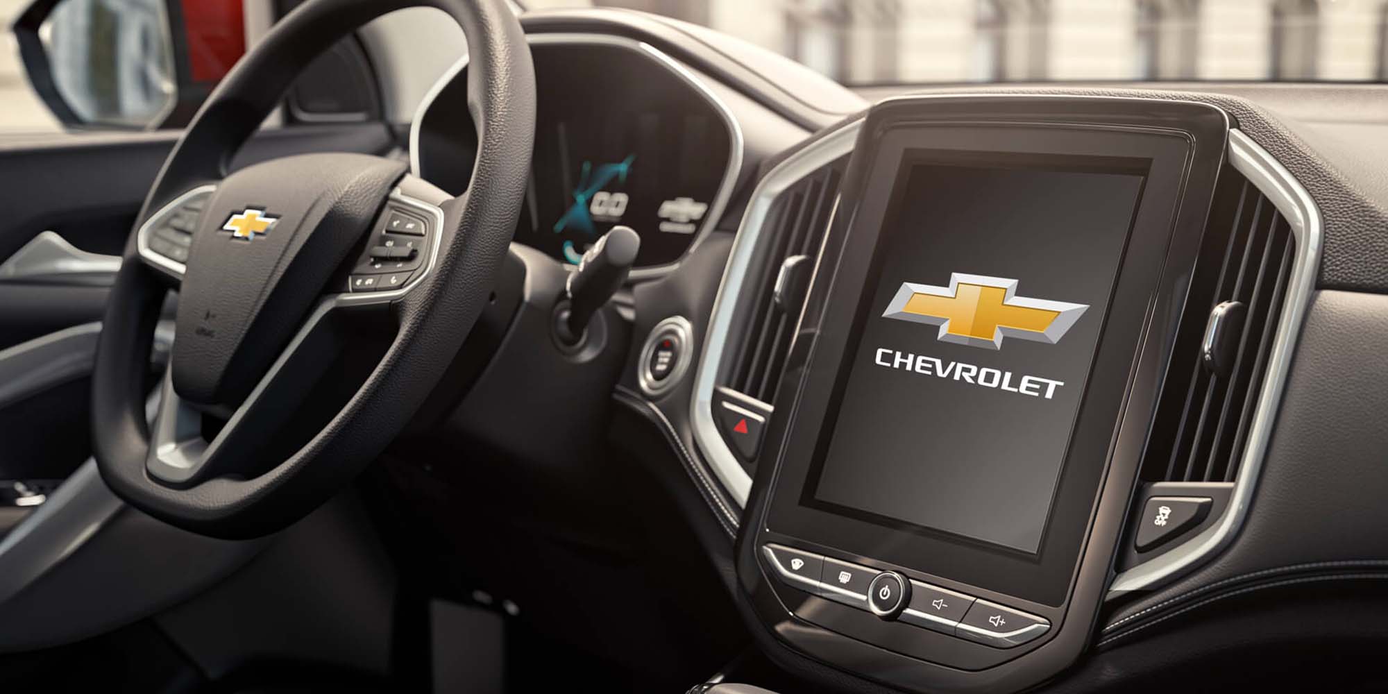 Interior de Chevrolet Captiva Chile con pantalla táctil multimedia, volante multifunción y tablero digital.